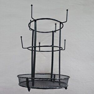 Black multi-tier metal mug tree holder with a basket base
